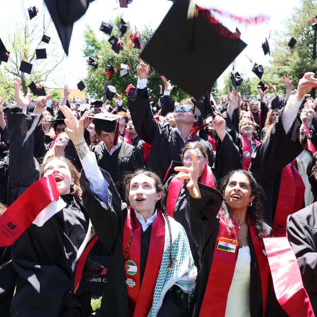 students tossing their hats at the 2024 Commencement Ceremony