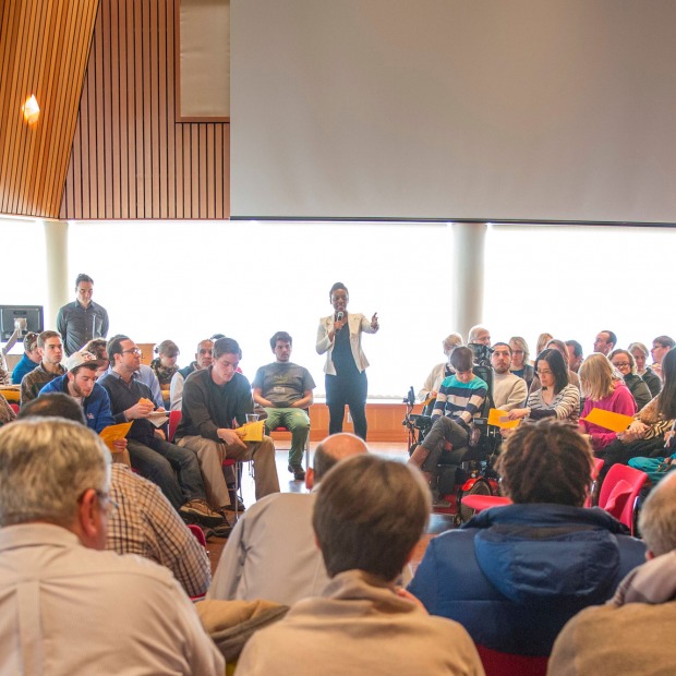 Student leads a town hall meeting in Rosenfield Center, Room 101
