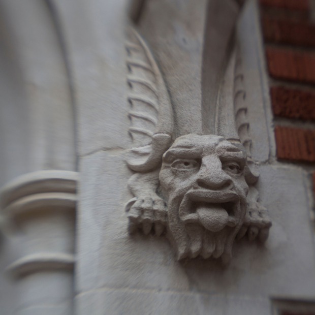 grotesque carved into stone columns