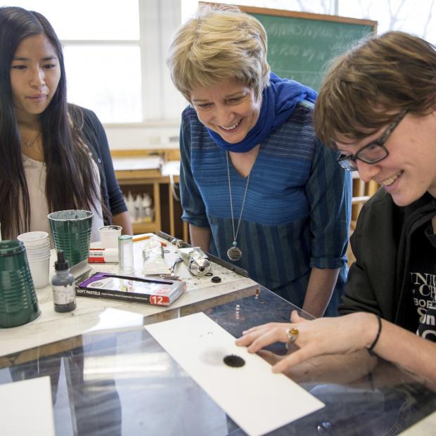 Students and Professor working together