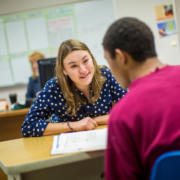 student looks encouragingly at another student
