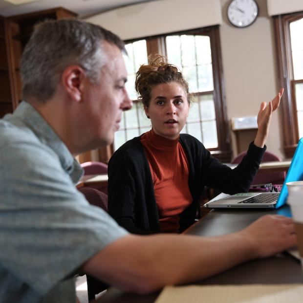 faculty member and student discuss research