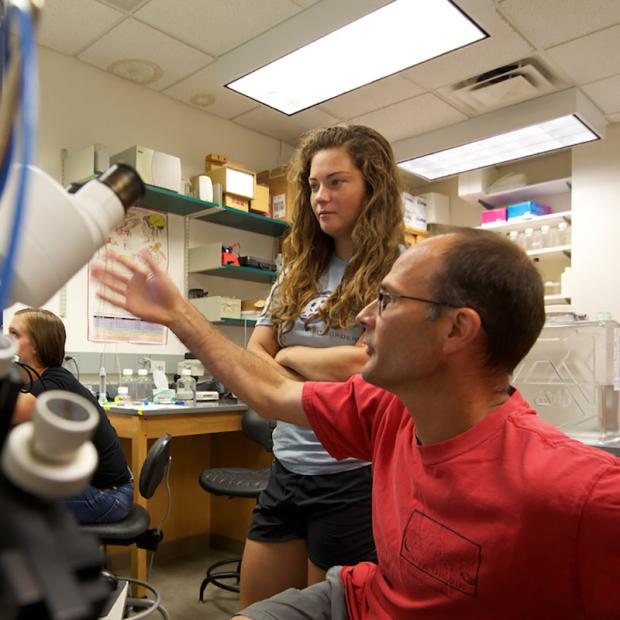 professor and student in science lab