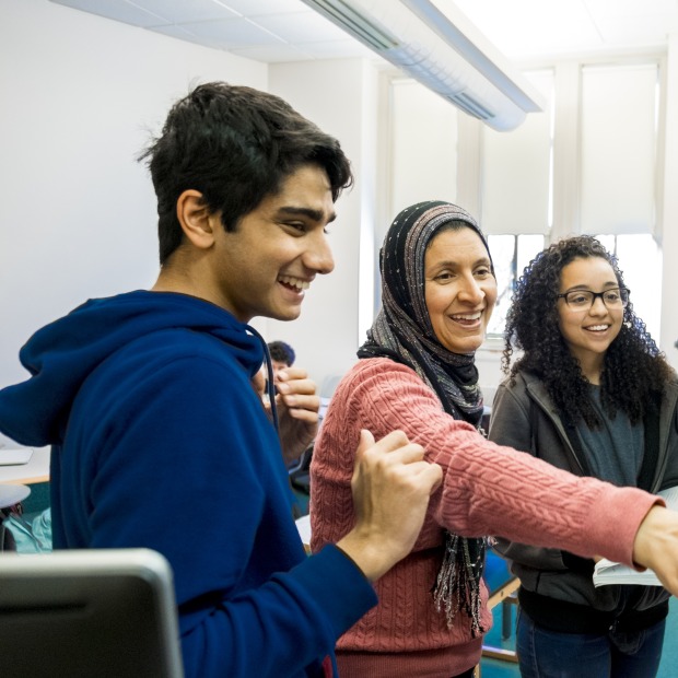Students and professor at the chalkboard in Arabic class
