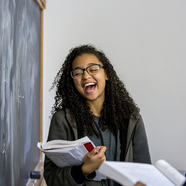 Cora Touchstone ’19 practices her Arabic alphabet on the chalkboard