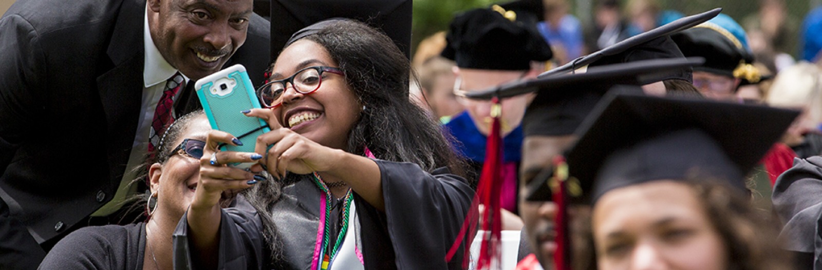 Gabrielle Matthews ’17 takes  a selfie with her family.