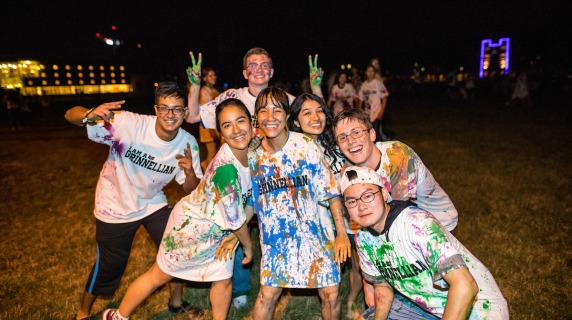 Students celebrating on Mac Field during pre-orientation programs.