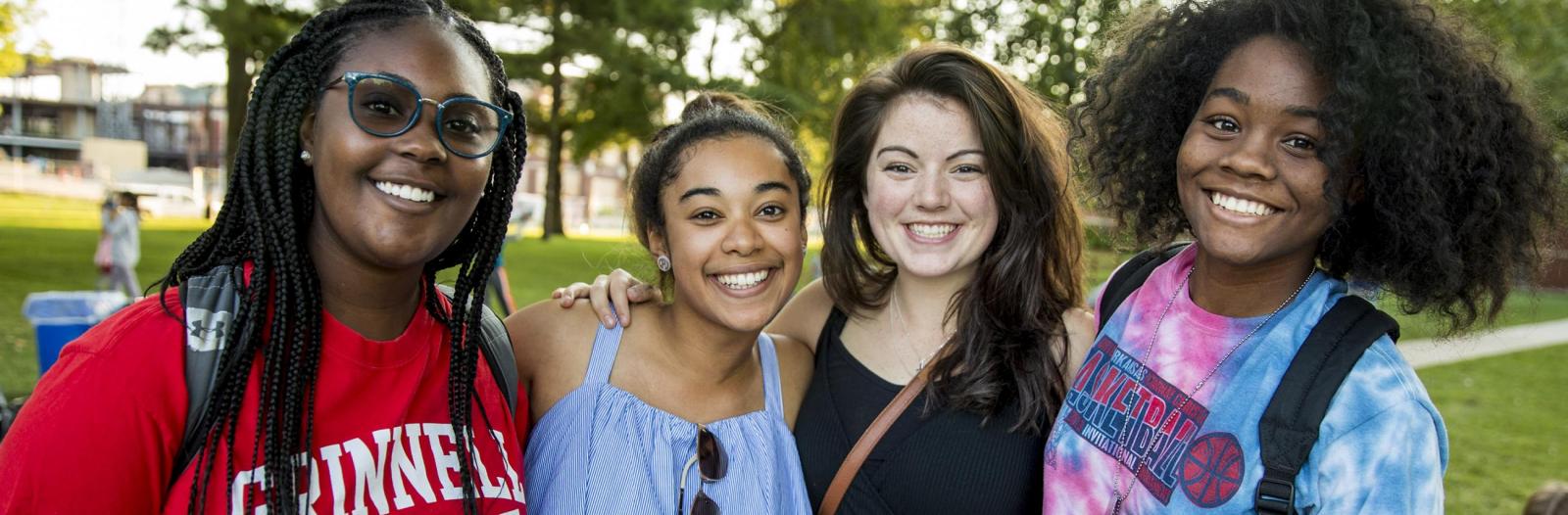 Four students smiling