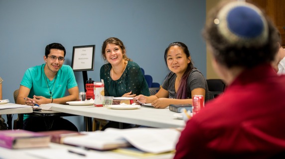 Students in CRSSJ studying text