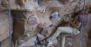 Student using the climbing wall