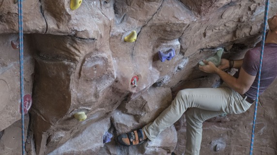 Student using the climbing wall