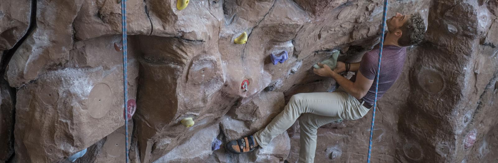 Student using the climbing wall