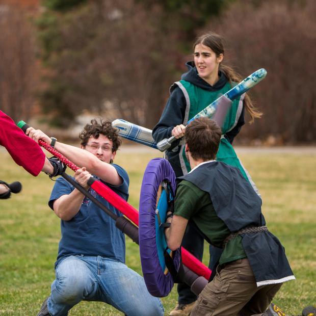Dagorhir students fight with foam weapons 