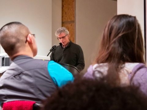 Professor John Garrison speaking to audience