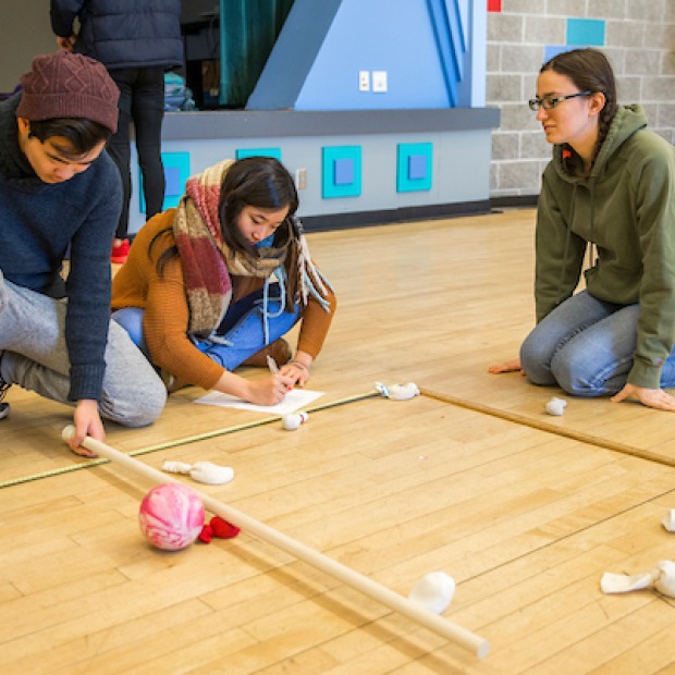 Students conduct physics experiment