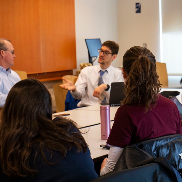 Group of students interested in education careers talk with Trace Pickering