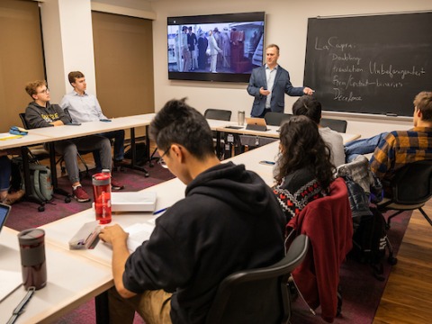 Dan Reynolds teaches in classroom