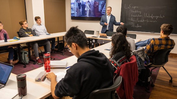 Dan Reynolds teaches in classroom