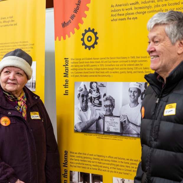Bill and Suzie Hansen standing by a photo of Hansen's Bakery in the exhibit