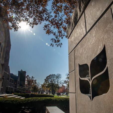 Grinnell College logo on stone gateway