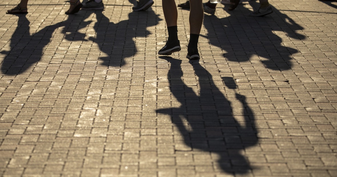 Shadows of people walking