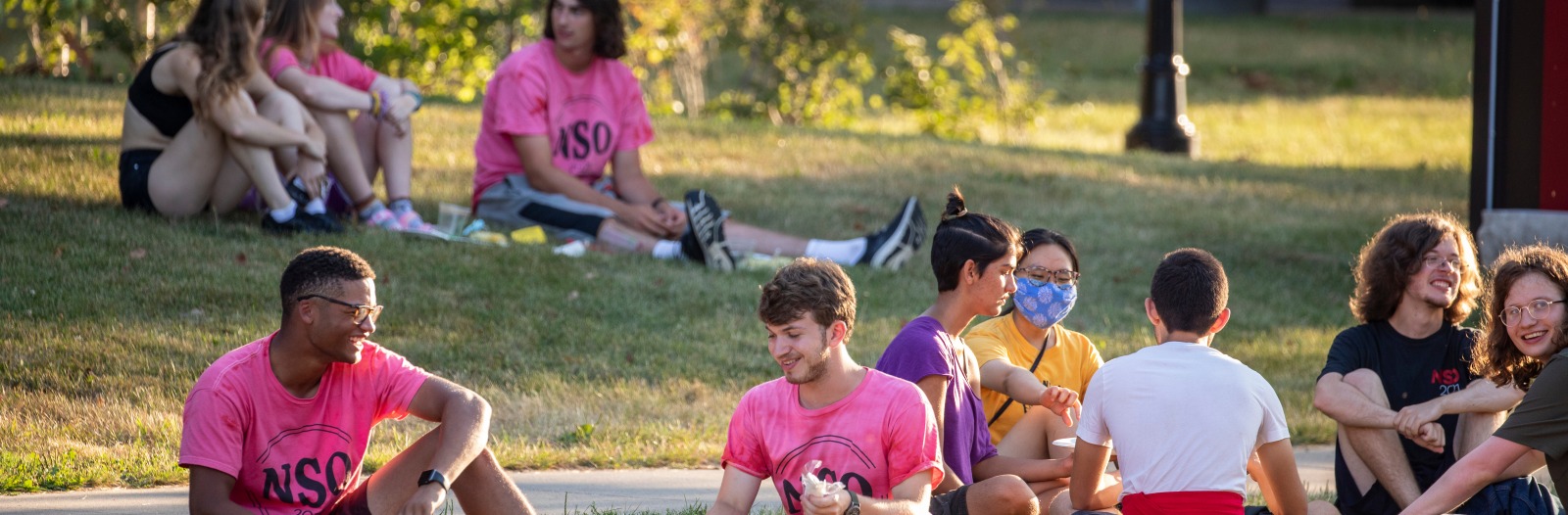 Students relax on the grass