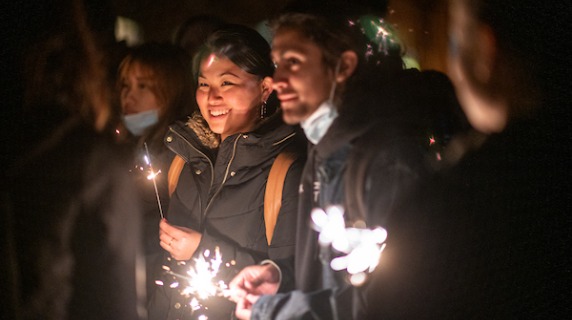 Students celebrate with sparklers at Arctic Lights