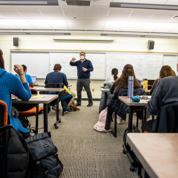 Professor in front of classroom full of students