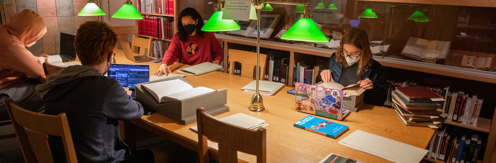 students and faculty doing research in Grinnell College archives
