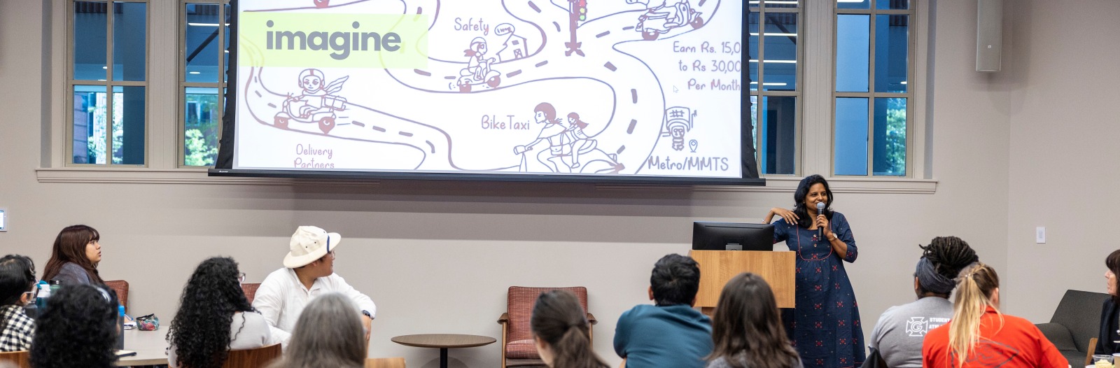 grinnell prize winner speaking with students