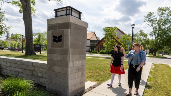 People touring campus near the Admission and Financial Student Services building