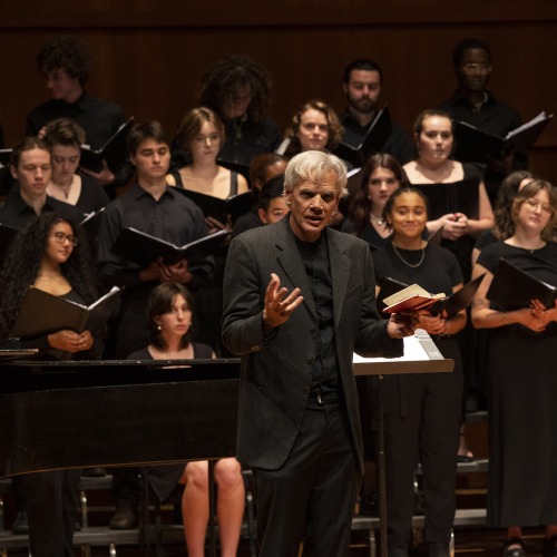 John Rommereim leads the Grinnell Singers at a concert in Sebring-Lewis Hall