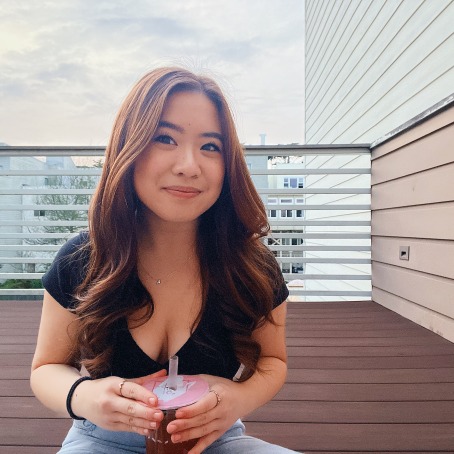 A woman smiles for a photo