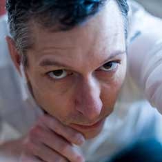 Andrw Kaufman eyes fixed concentrating on art creation