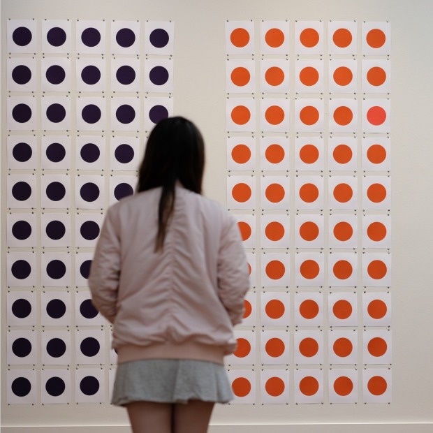 Student examines artwork