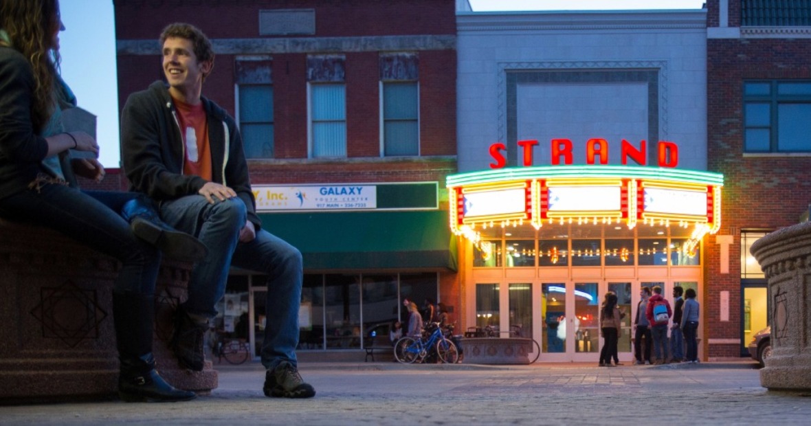 Strand Theater lights at dusk