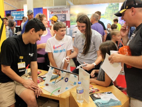 Collin Kramer works with younger students