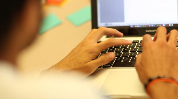 person working on a laptop computer