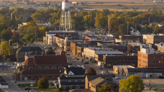 A bird's-eye view of downtown Grinnell with an old-style water tower