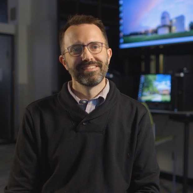 Erik Simpson in front of monitors