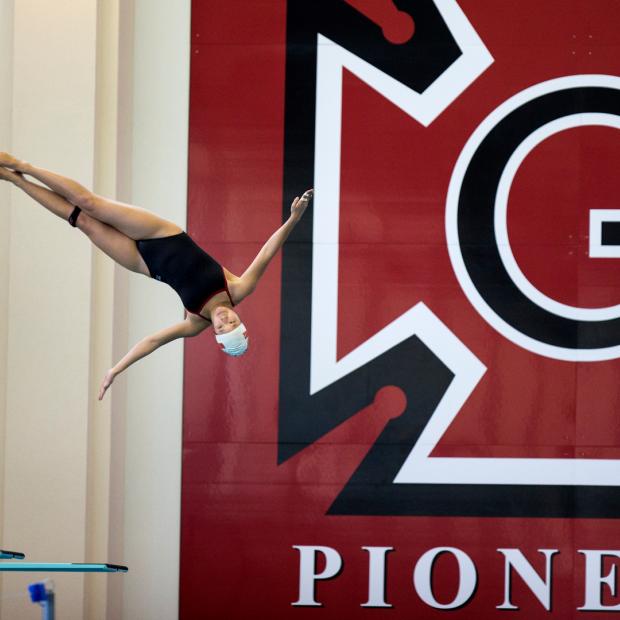 Grinnellian diving into the pool