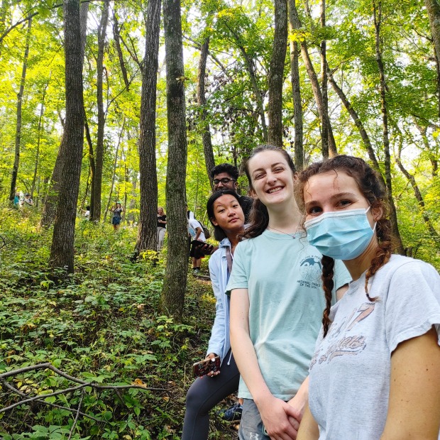 GORP participants lined up on a forested hill