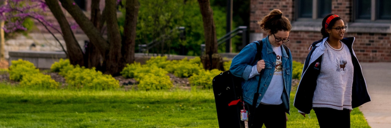 Two students walk on campus