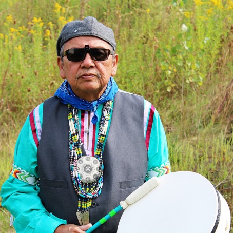 Ray Young Bear holding a drum