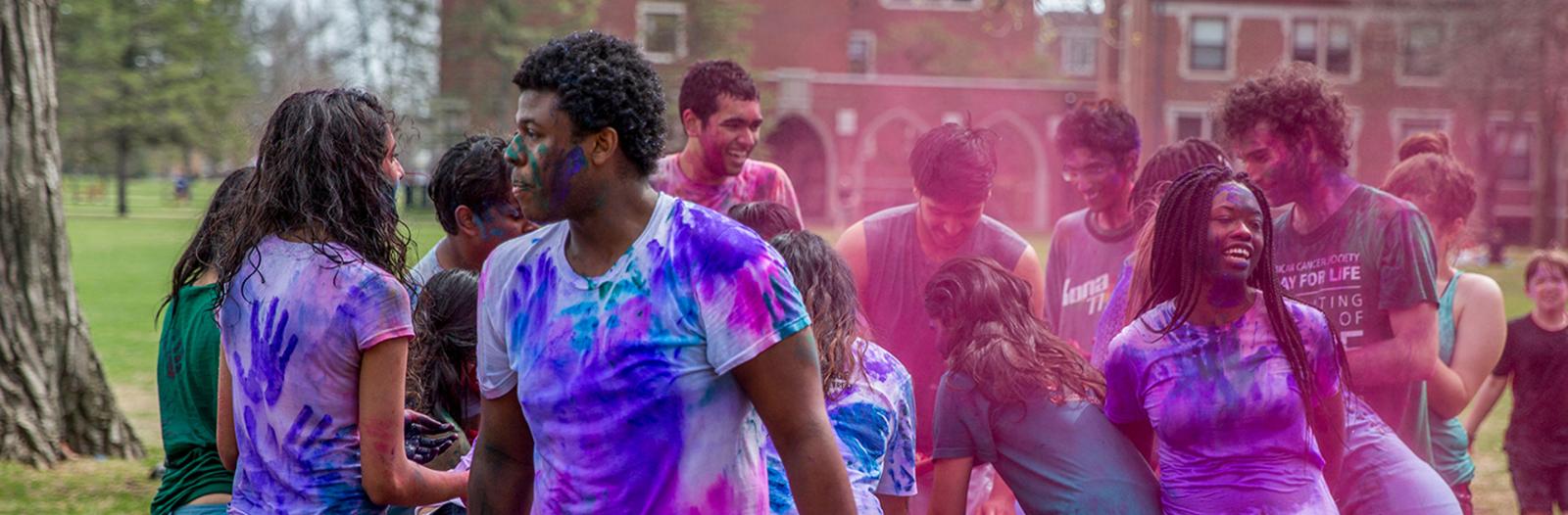 Students celebrate Holi with colored powders