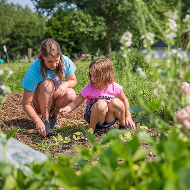 Student with child in college garden