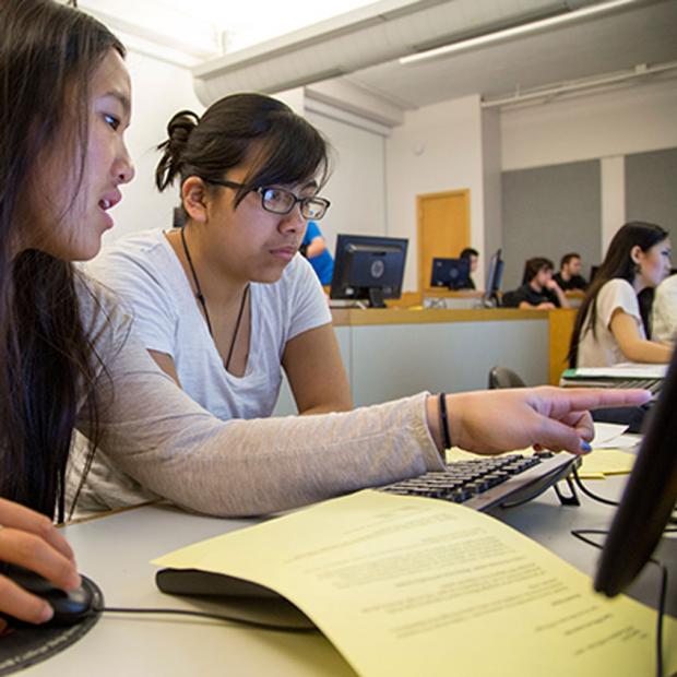 Two students working together at a computer