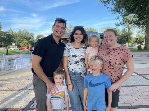 Family standing outstide