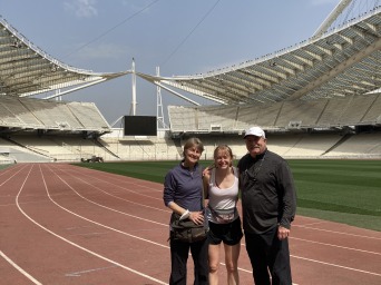 My coaches and I stand at a track white line