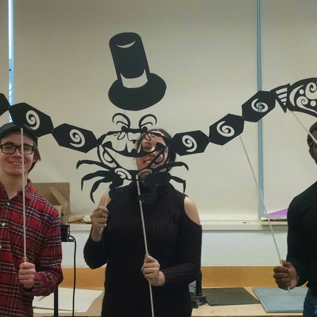 Students holding a shadow puppet